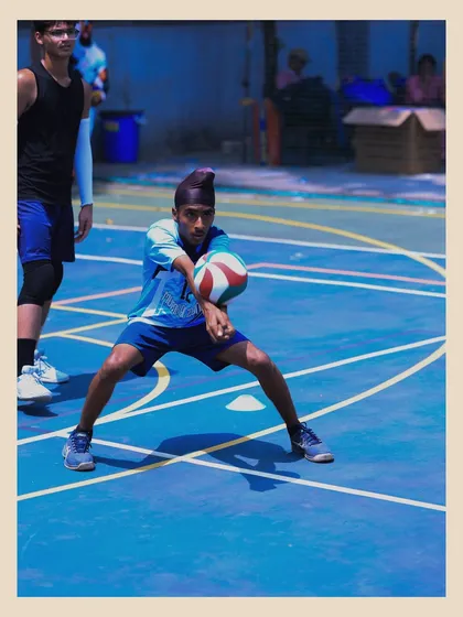 This player is in a low, athletic stance, ready to receive the ball. We teach our athletes to always be prepared and on their toes.