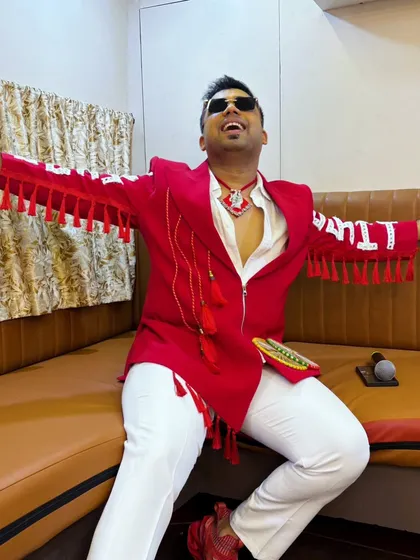 A fun, expressive pose backstage. This custom red jacket with "LIT" embroidered on the sleeve perfectly captures my hosting style.