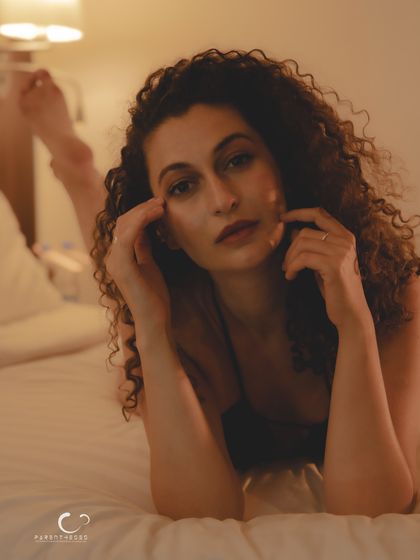 A direct and engaging gaze from the boudoir series. This portrait is intimate yet powerful, a testament to the strength found in self-acceptance.