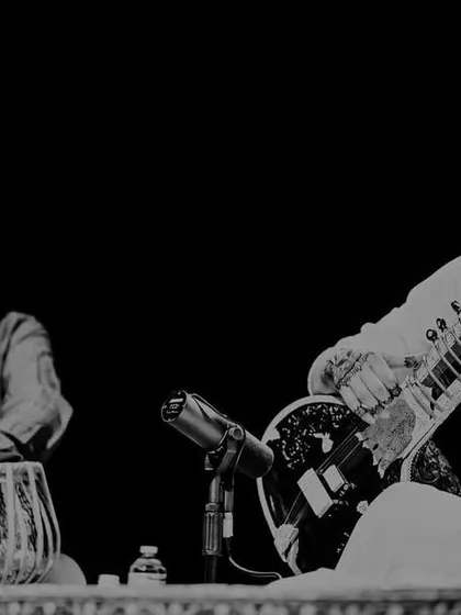 A black and white shot of me and my tabla player, Gurdain Singh, locked in a musical dialogue.