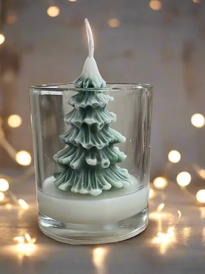 Illuminate the holiday season with our Christmas tree candle. This festive candle adds a warm, cozy ambiance and fills the air with the soothing scent of pine.
