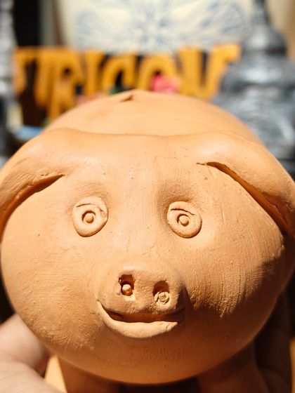 This adorable unpainted piggy bank is just one of the many fun shapes you can choose to paint and personalize.