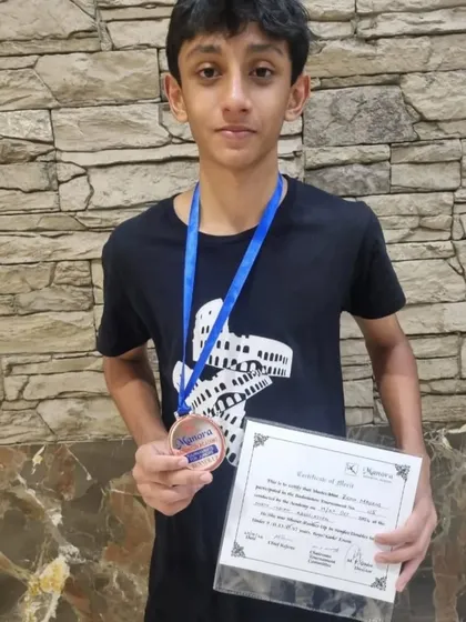 A closer look at Zehn Masani's silver medal from the Manora tournament. Every medal represents hours of practice and dedication.