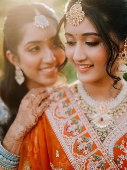 A sweet moment between the bride and her sister. Capturing these loving family bonds is a key part of my storytelling approach.