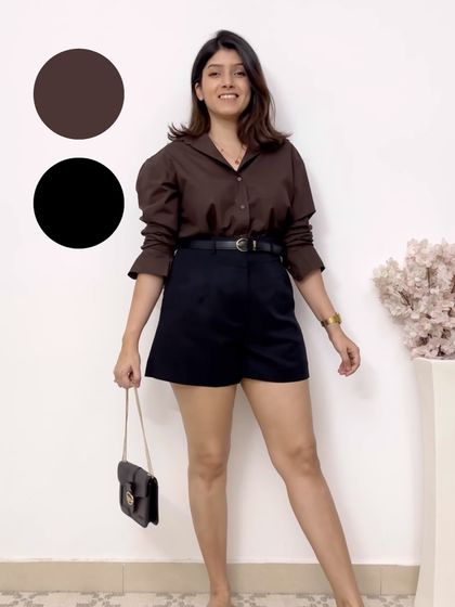 A classic and foolproof color combination: brown and black. The brown puff-sleeve shirt paired with black shorts is a chic and effortless look for any casual occasion.