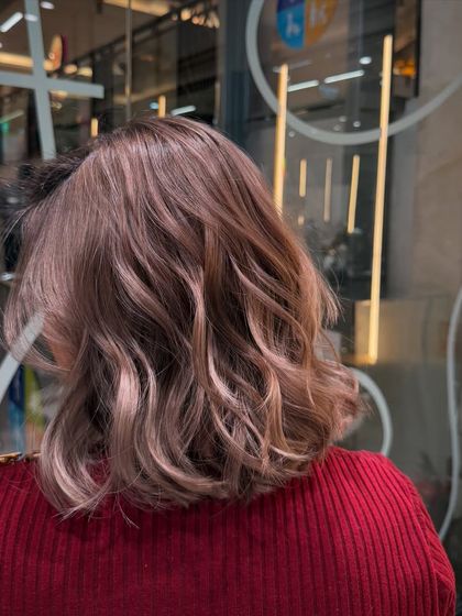 Another angle of the rosy-brown bob, showing the beautiful blend of tones and the healthy shine of the hair.