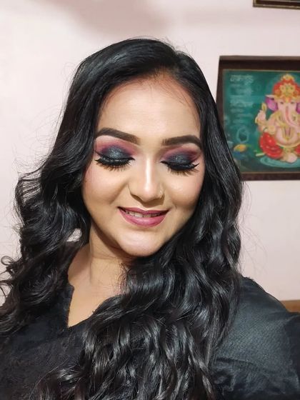 A close-up with eyes closed to show the blending of the pink and black eyeshadow.