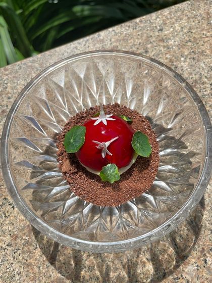The goose liver bonbon presented in a crystal bowl, highlighting its jewel-like appearance.