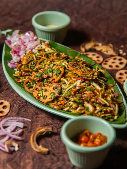 This is Singju, the dish that gave our restaurant its name. It’s a traditional Manipuri salad with a crunchy mix of fresh vegetables, lotus stem, herbs like perilla and fish mint, and a punchy dressing with fermented fish. It’s a bold flavour adventure in every bite.