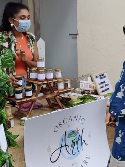 Here I am explaining my products to a curious customer. Pop-ups are the best way for me to connect with you and answer all your questions in person.