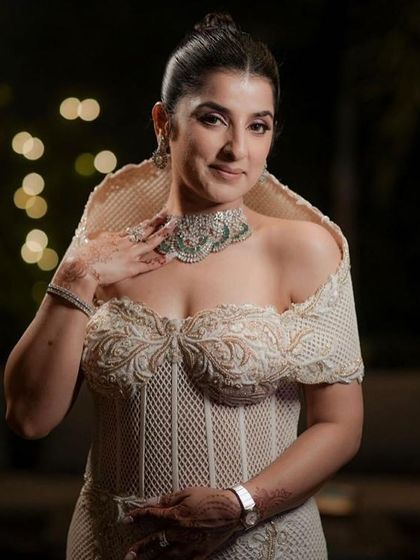 My client looking poised and elegant in the ivory corset gown, where every fold and seam speaks of quiet drama.