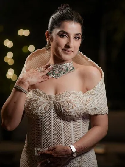 My client looking poised and elegant in the ivory corset gown, where every fold and seam speaks of quiet drama.