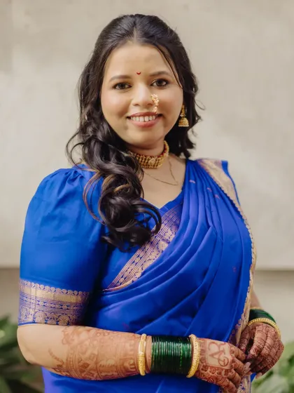 A simple yet elegant look in a royal blue saree. The soft curls and natural makeup make this a versatile look for any wedding function.