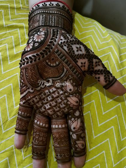 A highly detailed single-hand design, showcasing a mix of florals, paisleys, checks, and lotus motifs, demonstrating my intricate line work.