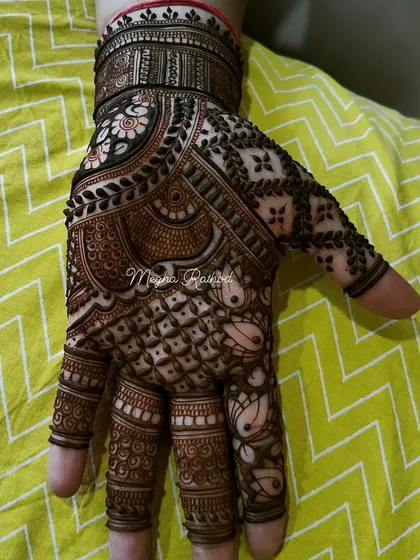 A highly detailed single-hand design, showcasing a mix of florals, paisleys, checks, and lotus motifs, demonstrating my intricate line work.