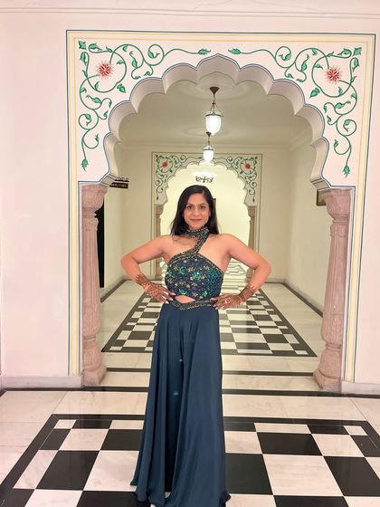 A front pose in a beautiful one-shoulder gown. Integrating my love for fitness with family functions.