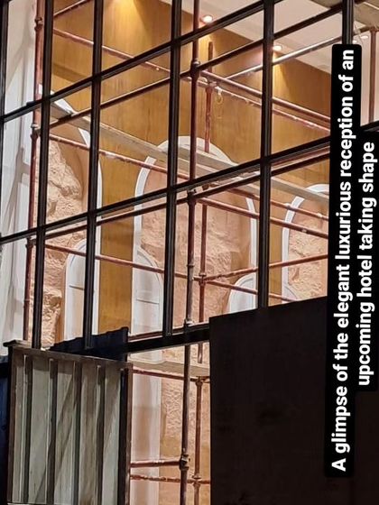 A glimpse of the hotel reception design taking shape on-site. This image shows the structural framework and backdrop being installed, demonstrating the first step in turning our elegant concept into a physical space.