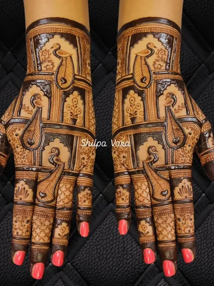 A striking design with repeating peacock figures in architectural frames, covering the entire back of the hands.