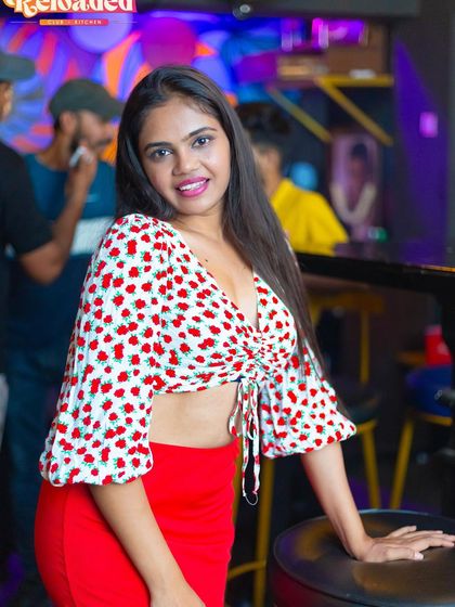 A guest in a cute cherry-print top.