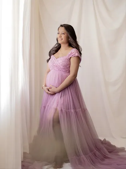 The full length of this lavender tulle gown is just beautiful. This pose showcases the dress while capturing a hopeful and happy expression.