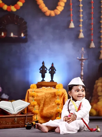 Another angle of the little Warkari, smiling brightly in our traditional Maharashtrian setup.