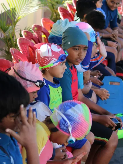 Young swimmers focused and ready for their event. We believe in creating a supportive and organized environment that helps even the youngest competitors feel confident and prepared on race day.