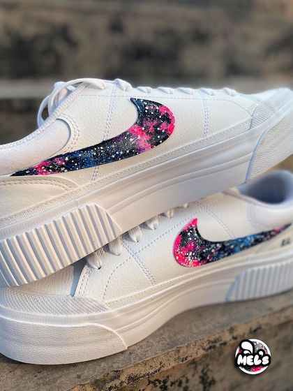 A close-up of the vibrant pink and blue galaxy pattern on the Nike swoosh.