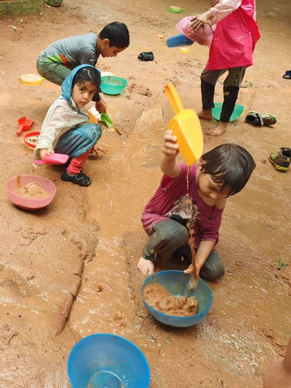 The sandpit becomes a landscape for cooking, building, and social interaction. With simple, open-ended tools, the possibilities for play are limitless.