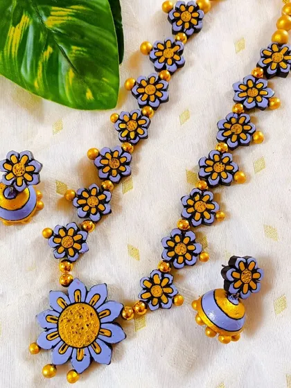 Here is the floral necklace in a lovely lavender and yellow. The pastel purple is soft and feminine, making it a very pretty choice.