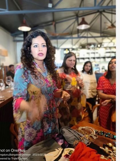 Leading a 'Dress for Success' session with members of the Herkey women's organization. The workshop covered styling, accessorizing, and dressing according to body shape and personal colors.
