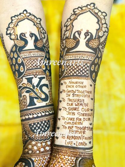 Another look at the wedding vows design, paired with the couple's initials and peacock figures in a jharokha.
