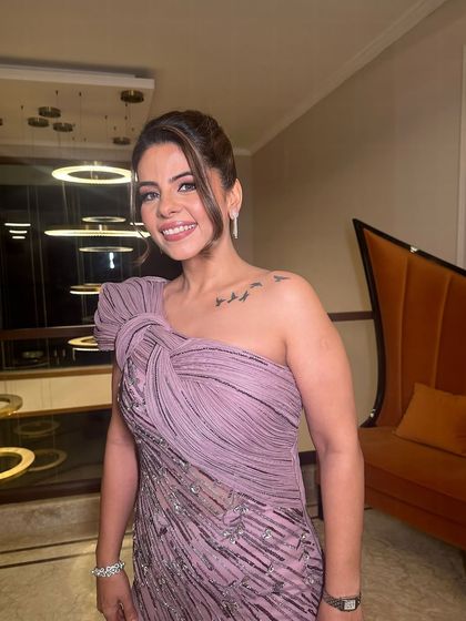 This updo is all about soft texture and effortless style, perfect for a glamorous yet comfortable look.