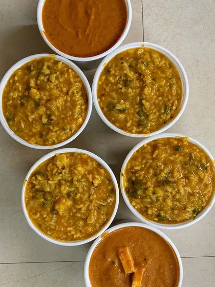 Bowls of flavorful BisiBele Bhath and Paneer curry.