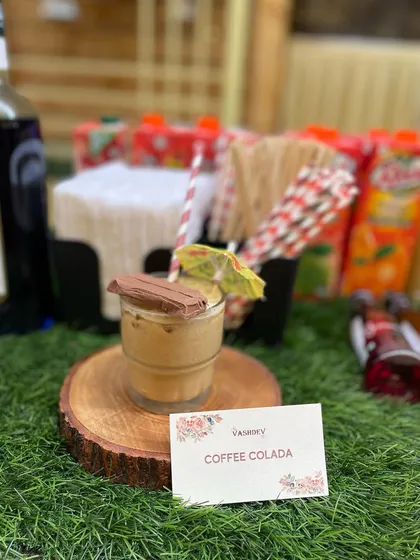 For coffee lovers, our Coffee Colada is a creamy and indulgent mocktail, garnished with a piece of chocolate.