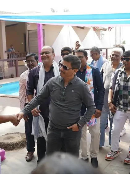 Engaging with the guests during a carnival party. I make sure to interact with everyone, not just the couple, to create an inclusive atmosphere.