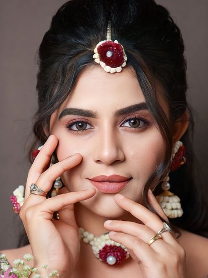 A final portrait of the sangeet look, with the model looking directly at the camera. The makeup is fresh, youthful, and perfect for a celebration.