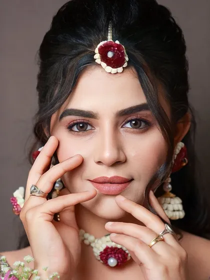This image showcases the natural yet defined makeup that is perfect for pre wedding festivities. It looks effortless but is achieved through precise techniques.