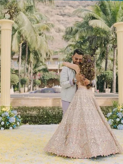 A beautiful moment between the couple, Aashvi and Akash, during their Haldi ceremony. The decor, with its floral-lined pillars, provided a romantic and picturesque setting.