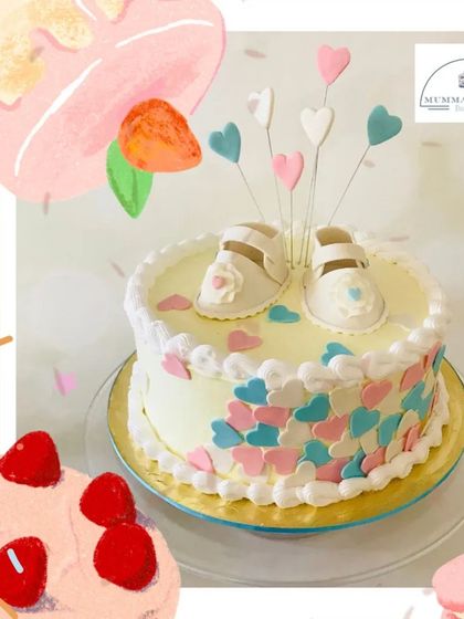 Tiny shoes for tiny feet. This adorable baby shower cake is decorated with delicate sugar hearts and a pair of fondant baby booties, making it a sweet and classic choice.