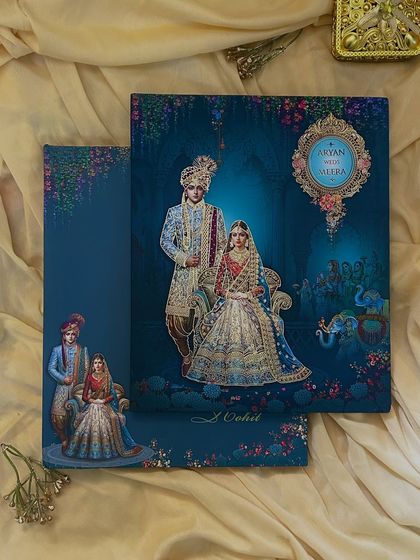 A full view of a vintage-inspired royal blue invitation, where the couple's portrait is the centerpiece, surrounded by a dreamlike, mystical forest.