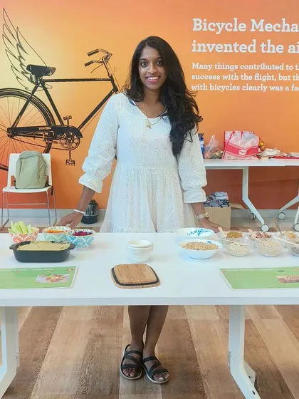 Setting up for a 'Wellness Carnival' at a corporate event. I love creating these spreads with DIY health bars, trail mix stations, and yogurt bowls. It shows teams that healthy food can be delicious, varied, and fun to assemble together.