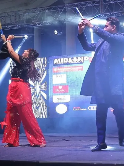 A performance shot from the 'City Dandiya Nite' by Radio City. My partner Urvashi and I are performing a high-energy Dandiya duet on the main stage.