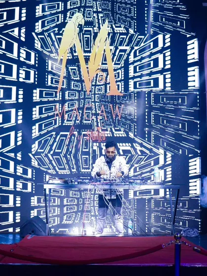 As a VDJ, I transform venues with custom visuals on massive LED screens. This image captures how my branding and graphics become a central part of the stage design, creating a concert-level experience.