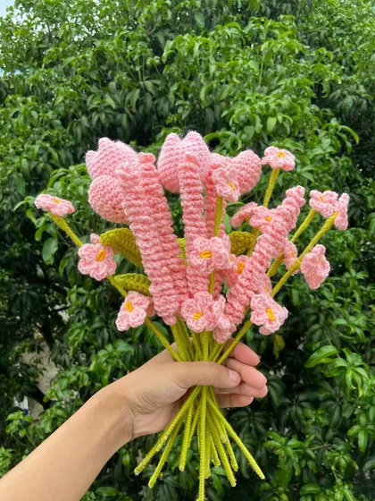 A lovely pink-themed bouquet with a mix of different flower shapes.