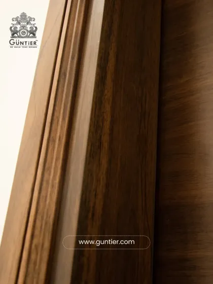 The details matter. This close-up shows the precise craftsmanship of a door frame and architrave, designed to perfectly complement the veneer door for a complete, seamless look.