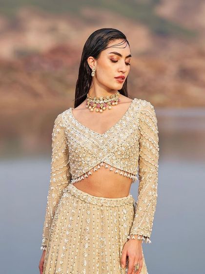 This selection showcases the breadth of my bridal and couture curation. It includes a variety of lehengas, gowns, and sets in different colors and styles, from traditional reds by Anupraas to modern ivories by Mirroir and Varun Chakkilam, ensuring every bride finds her perfect look.