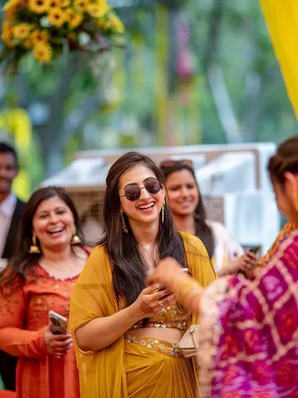 A candid shot of guests laughing and dancing, capturing the vibrant energy of the celebration.