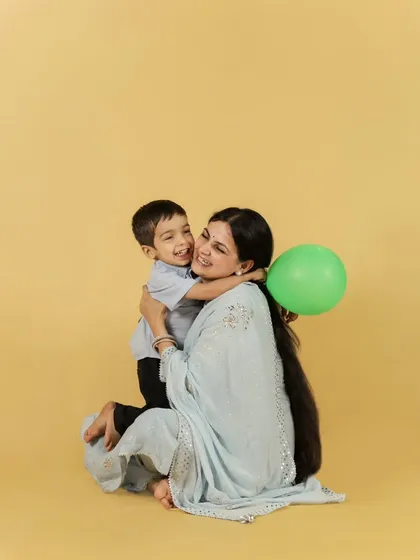 A mother and son sharing a warm hug. These moments of pure, unposed affection are what we strive to capture.