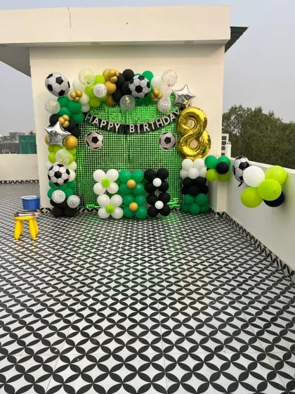 A full view of the rooftop football party setup, showing how the decoration transforms an open space for a celebration.