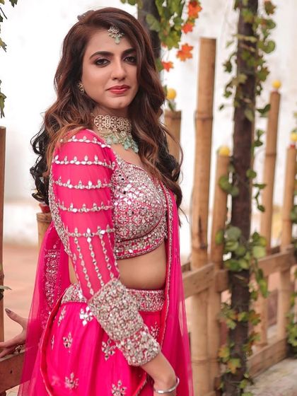 The complete look is a perfect balance of glamour and elegance, making her the star of her engagement party.